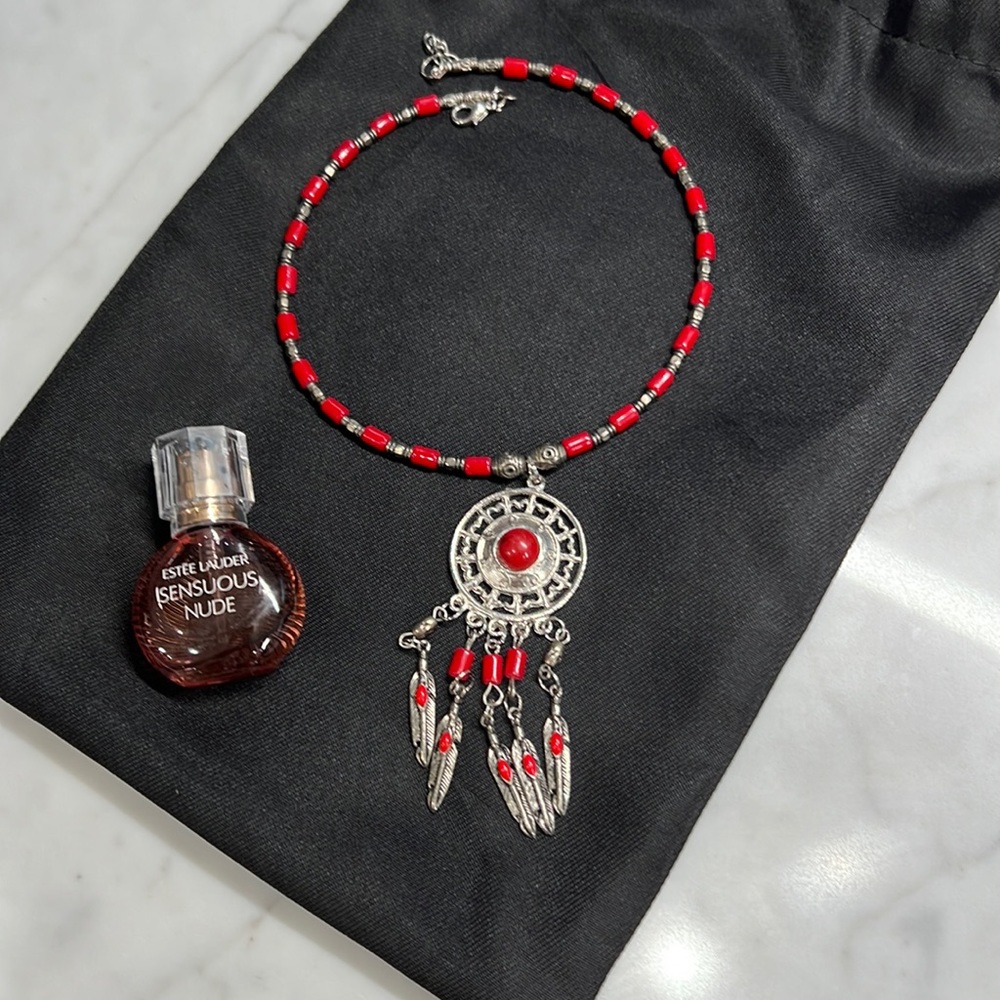 Women necklace with small full bottle perfume